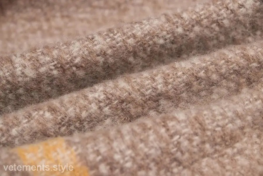 Textured beige woolen fabric with weave, showcasing Woven Wool Stitching Scarf in Rose Plaid Navy