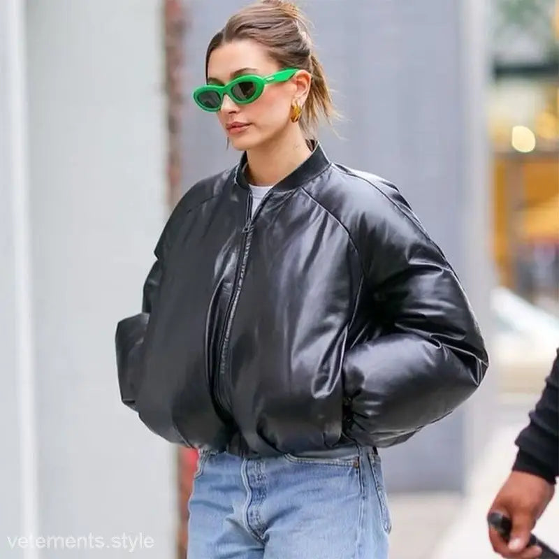 Black satin bomber jacket with relaxed fit, ideal as a cotton cozy jacket in solid color long sleeve style