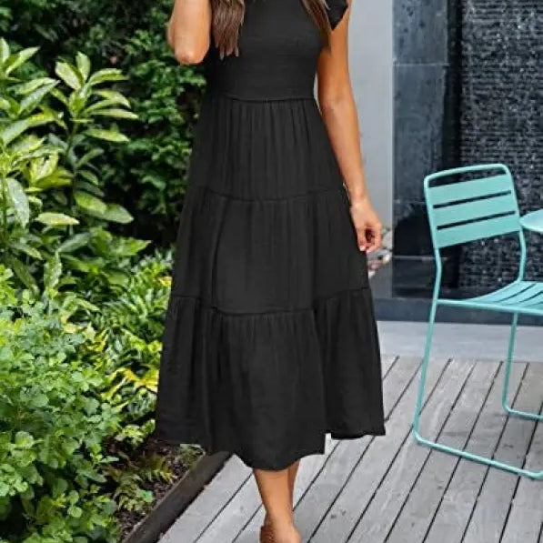 Black tiered midi dress featuring flounced large swing design with cutout details