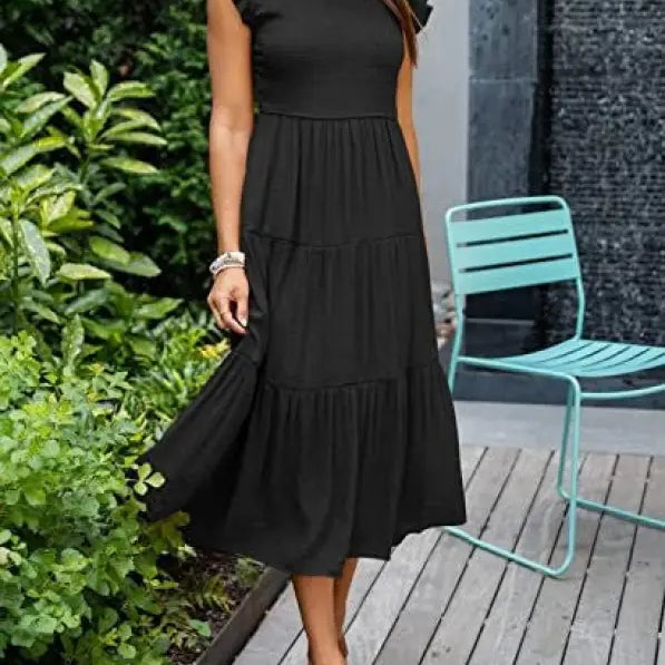 Black tiered midi dress featuring flounced large swing style with cutout details