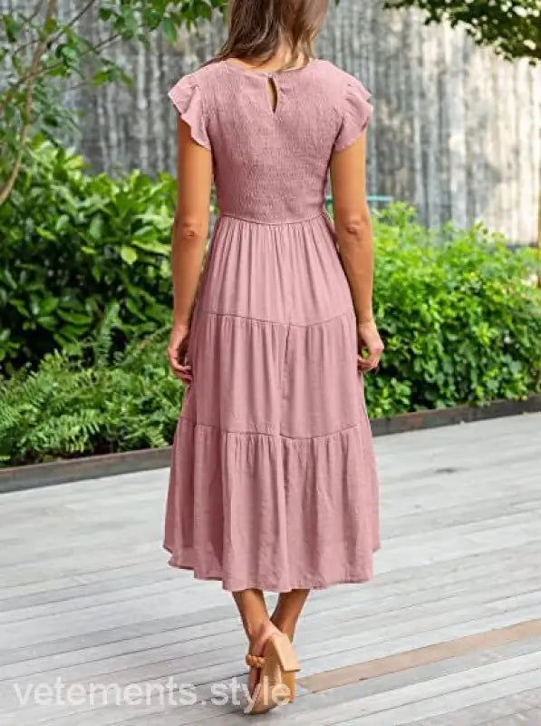 Pink tiered midi dress featuring flounced large swing design and cutout details