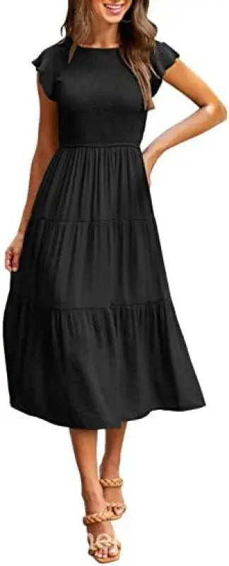 Black tiered midi dress featuring flounced large swing design with ruffle and cutout details
