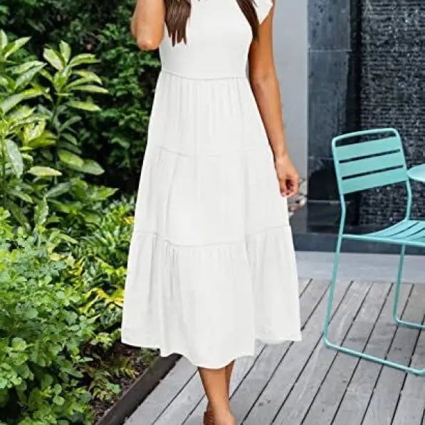 White tiered midi dress featuring flounced large swing design and ruffle details