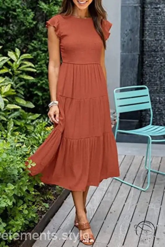 Army green flounced large swing dress with rust-colored tiers and ruffles