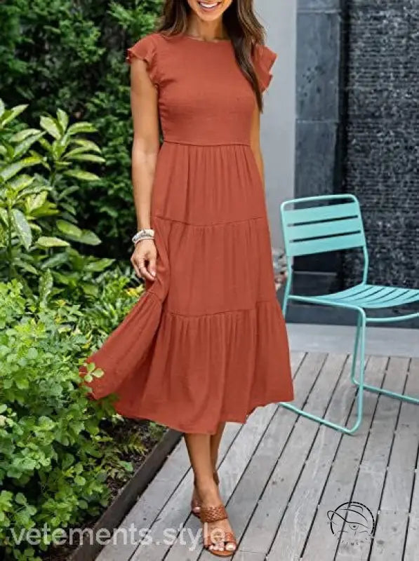 Army green flounced large swing dress with rust-colored tiers and ruffles