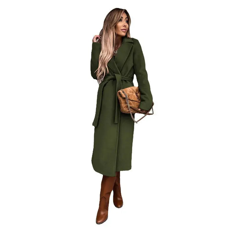 Long green wool coat with a belted closure, featuring a polo collar and long sleeves