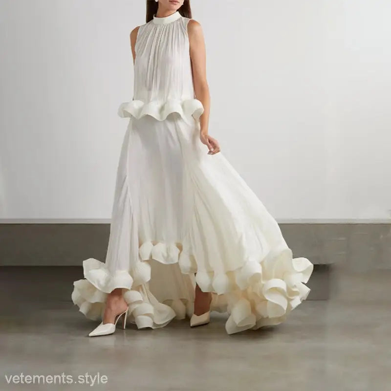 Elegant white sleeveless gown featuring asymmetric patchwork ruffled details for summer