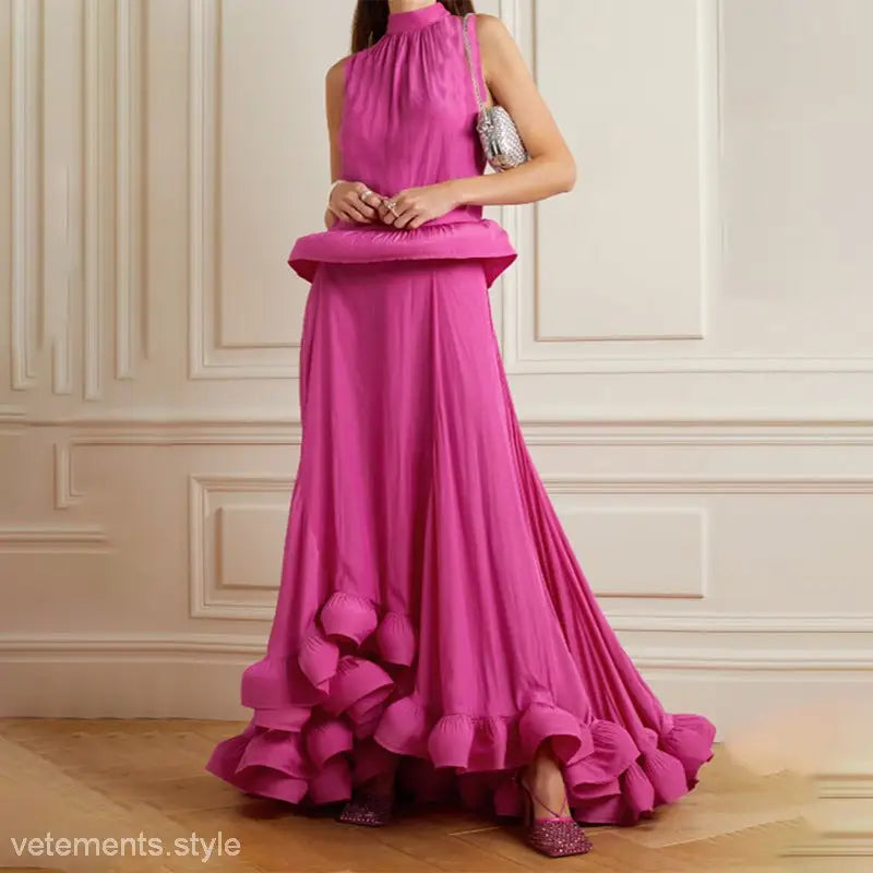 Vibrant fuchsia evening gown featuring asymmetric patchwork ruffled design in two piece suit