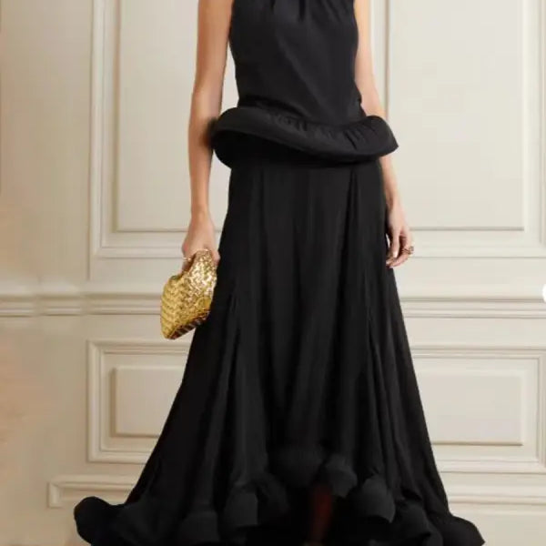 Elegant black sleeveless gown with asymmetric patchwork ruffled skirt and peplum waist