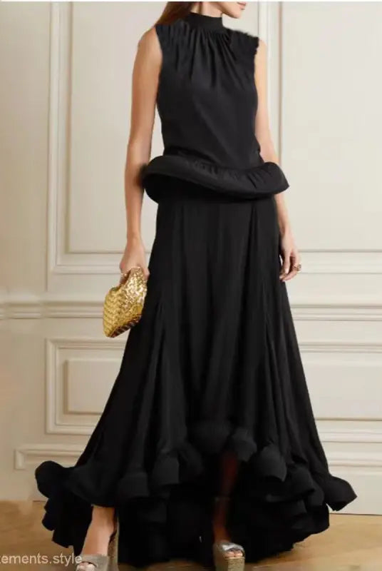 Elegant black sleeveless gown with asymmetric patchwork ruffled skirt and peplum waist