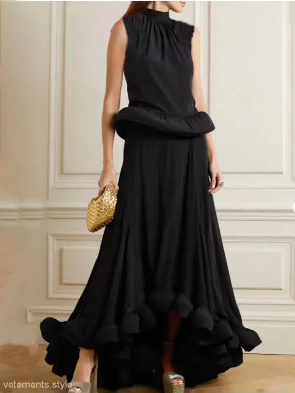 Elegant black sleeveless gown with asymmetric patchwork ruffled skirt and peplum waist