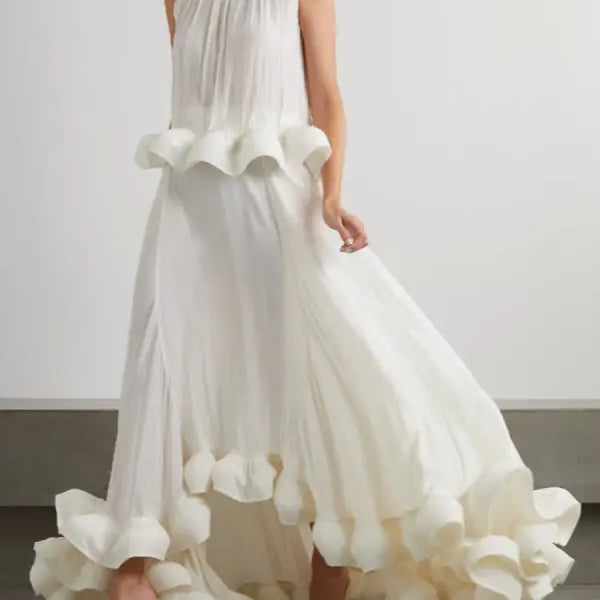 Elegant white sleeveless gown featuring asymmetric patchwork ruffled details in a two piece suit