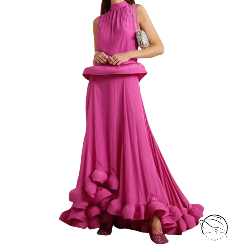 Vibrant fuchsia two piece suit with asymmetric patchwork ruffled skirt