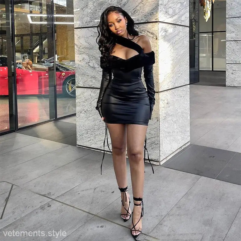 Woman wearing a stylish faux leather sheath dress with cutout details and long sleeves