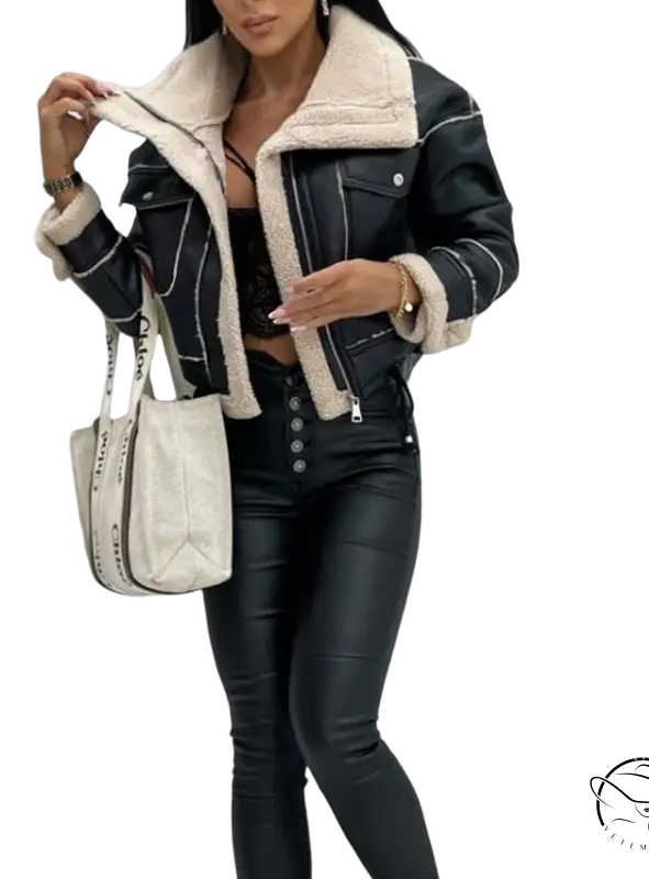Woman in black leather faux shearling jacket and matching pants for fall and winter