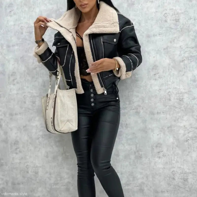 Woman in black leather faux shearling jacket and matching pants for fall and winter