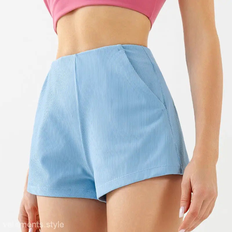Light blue high waist yoga shorts with ribbed corduroy texture, ideal for comfort and style