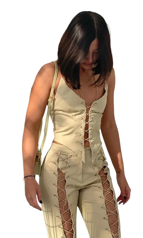 Woman in sexy backless bandage corset top with pale yellow lace-up jumpsuit