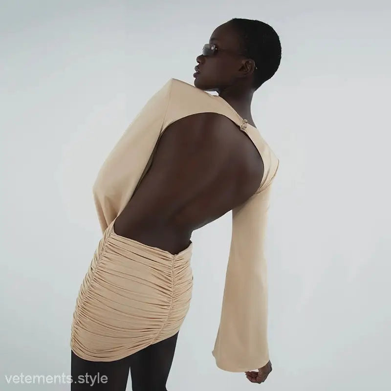 Beige backless bodycon dress with ruched V-neck and cutout details, perfect as a floral dress or neck floral dress