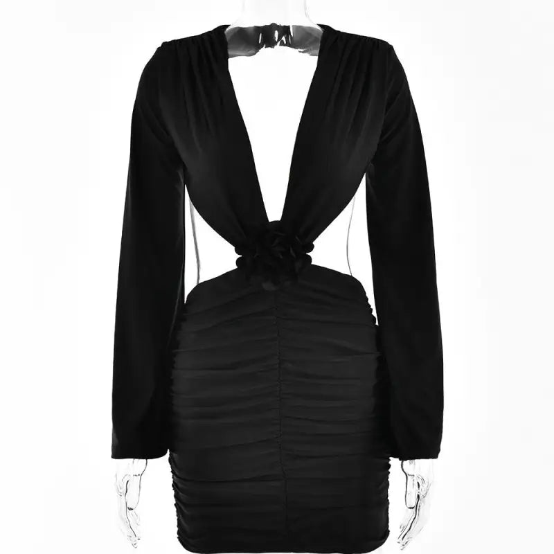 Black long-sleeved mini dress with deep V-neck and side cutouts, ideal for a neck floral look