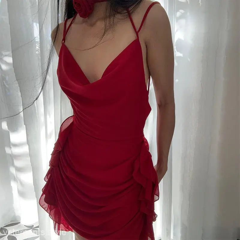 Red cowl-neck mini dress featuring ruffles and asymmetrical design, ideal for moon party dress occasions