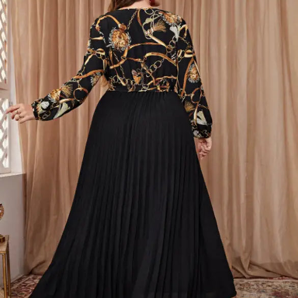 Black pleated maxi dress featuring a chain print top, ideal for a beautiful evening dress