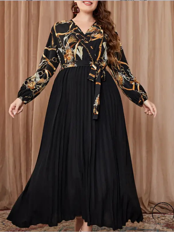 Beautiful evening dress with long-sleeved chain top and pleated skirt