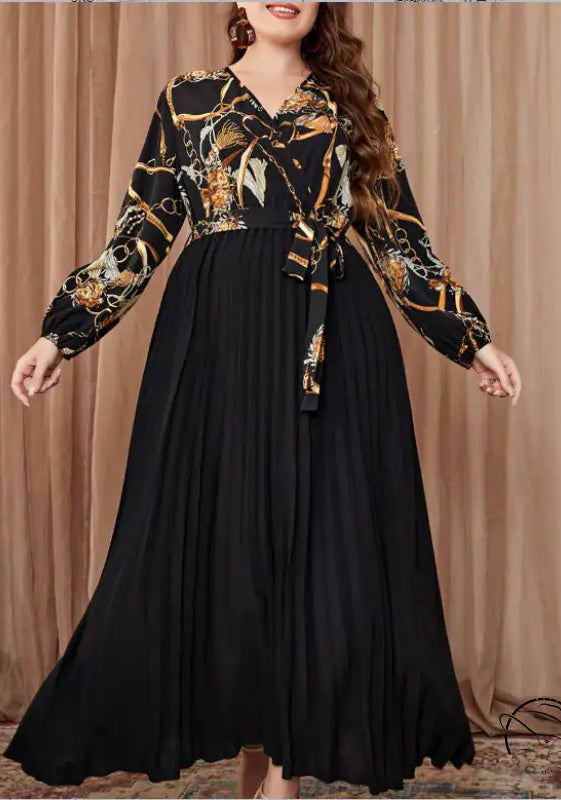 Beautiful evening dress with long-sleeved chain top and pleated skirt
