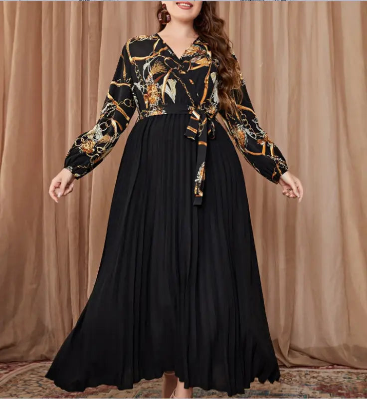 Long-sleeved chain-patterned top with pleated black skirt for a beautiful evening dress