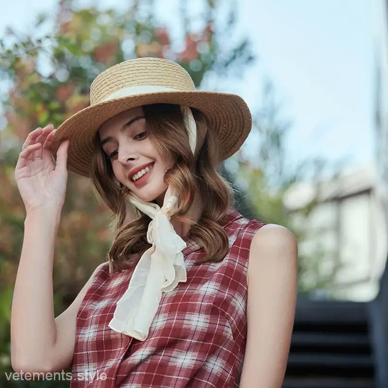 Beige wide-brim sun hat with white ribbon band for stylish sun protection