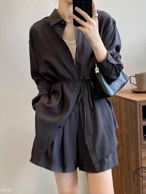 Black button-up sun protection shirt dress with waist tie