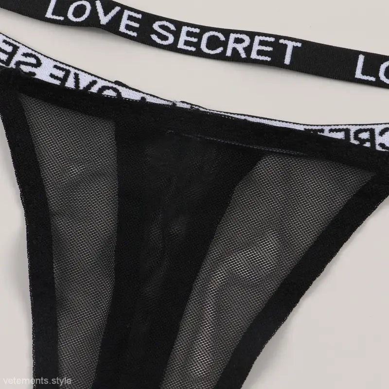 Black mesh lingerie showing the Black Lace Tulle Thong, a sexy lace piece thong sold style