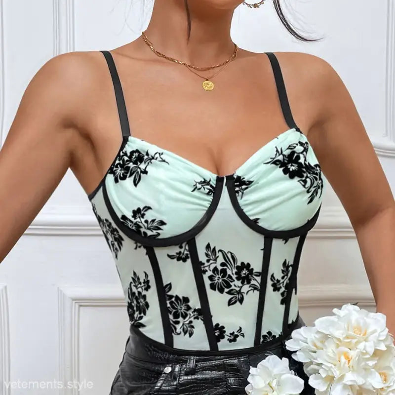Light green bustier top with black floral patterns, black trim, part of Black Roses Boning Corset collection
