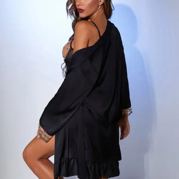 Woman in black lingerie and robe showcasing the Black Satin Midi Dress with Belted Sleeve