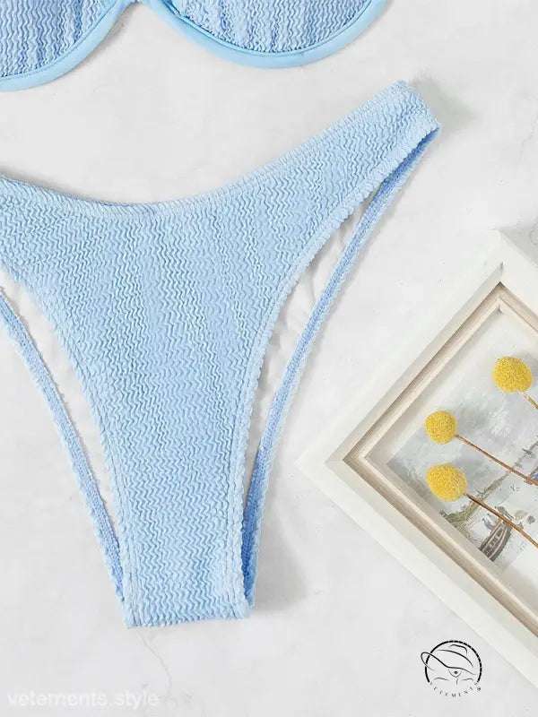 Blackish green steel bracket swimsuit with light blue textured bikini bottom