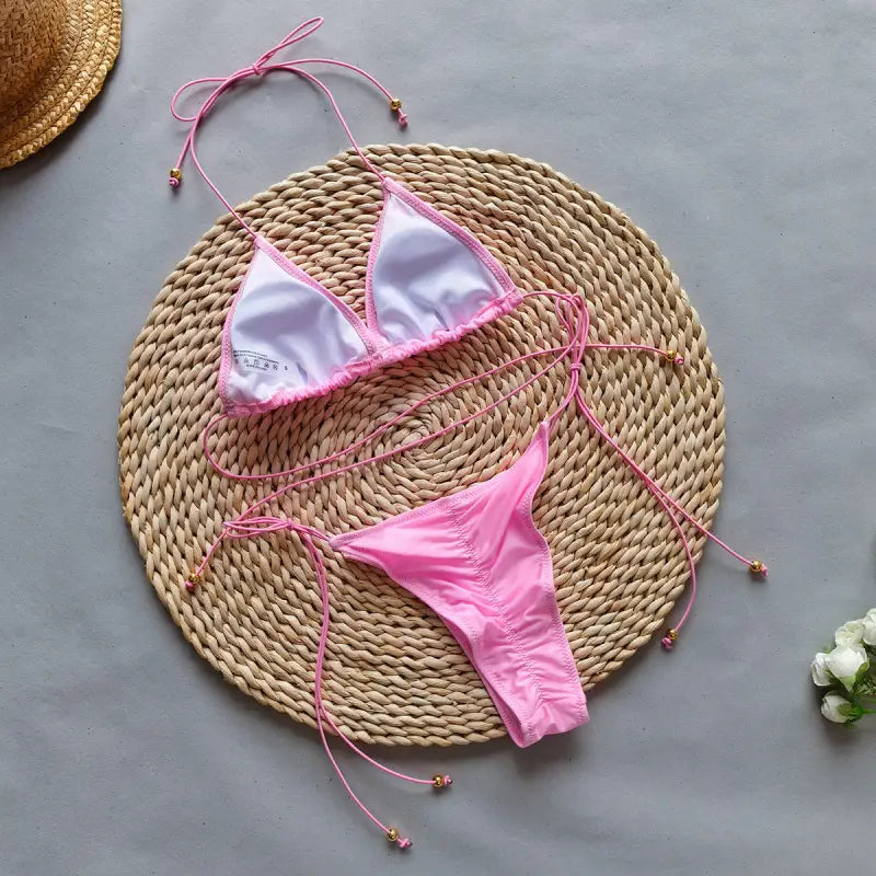 Pink string bikini shown in Boho Bikini Rope Halter Top for summer vacations