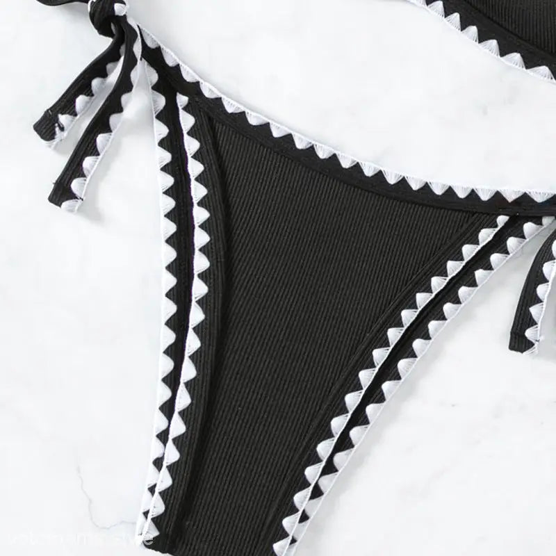 Black ribbed bikini bottom with white trim from the Boho Black & White Bikini collection