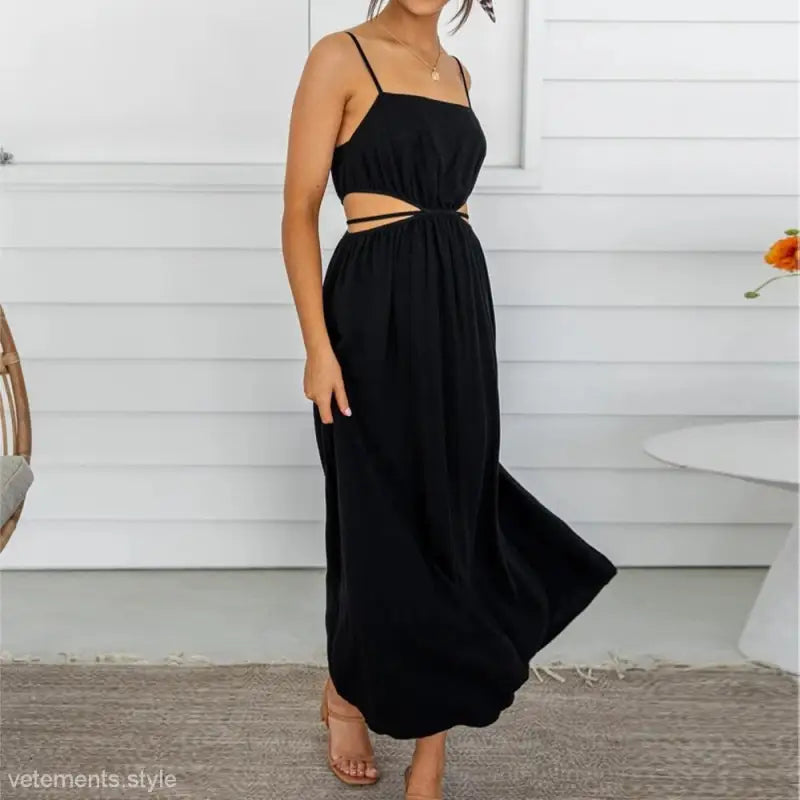 Black maxi cami dress with spaghetti straps and cutout waist detail for summer fashion