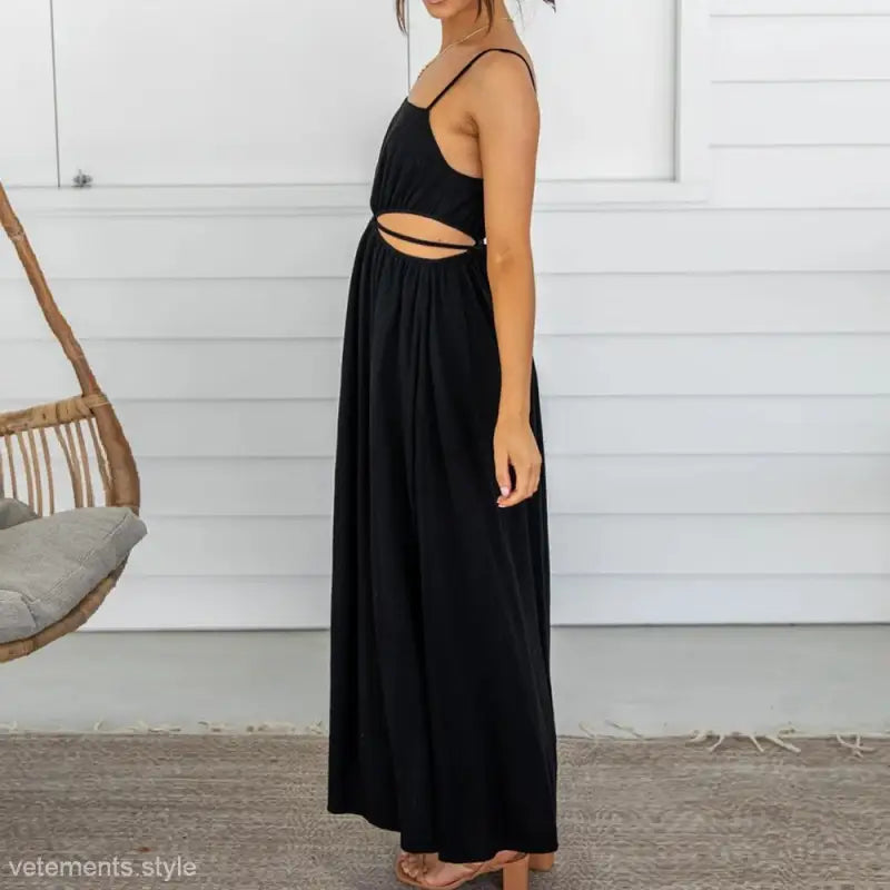 Black maxi dress with spaghetti straps and waist cutout for a stylish cami dress look