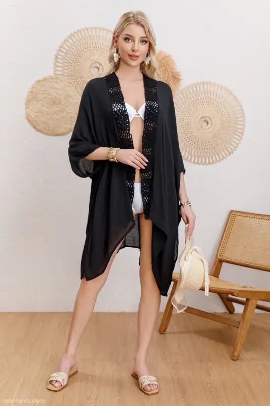 Black open-front beach coverup with lace trim and flowing sleeves for sun protection jacket