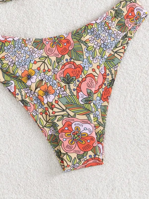 Vibrant floral-patterned bikini bottom with sexy push design, perfect for summer, free shipping available