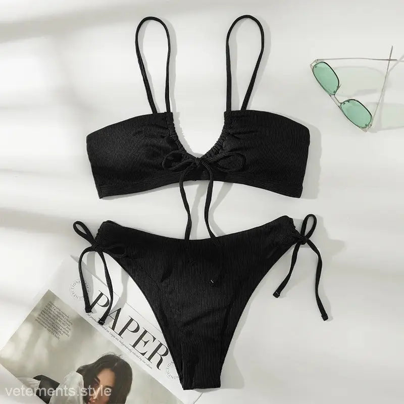Black high waist bikini set with tie details on top and bottoms, perfect for stylish beachwear