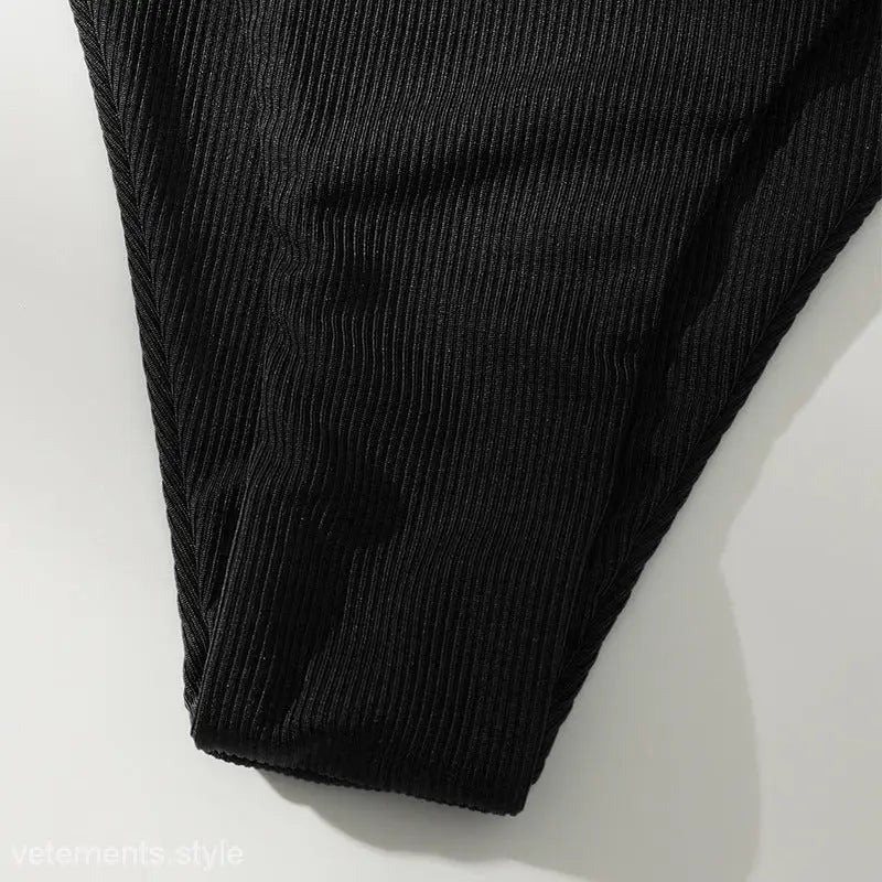 Black corduroy fabric showing texture and edge for high waist bikini swimsuit design
