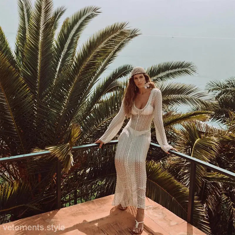 Woman in a sheer white dress showcasing the Summer Beach Dress for vacations