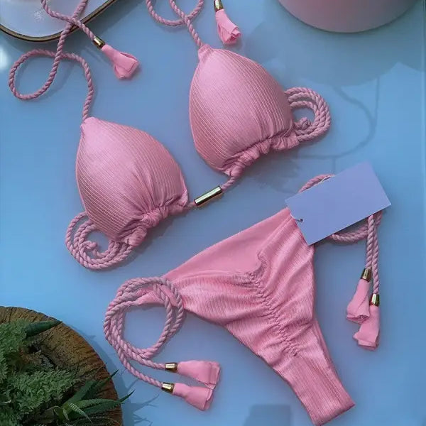 Pink rope swimsuit bikini featuring braided rope straps and tasseled ends