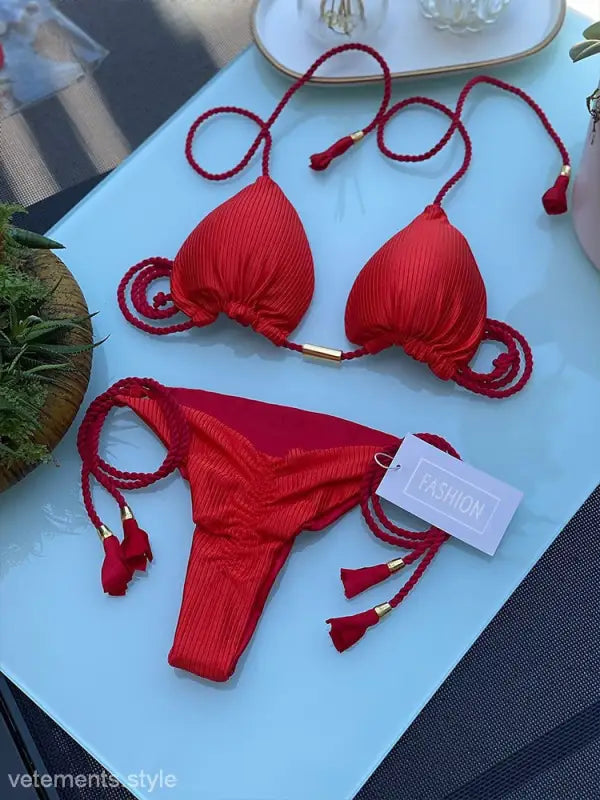 Red bikini swimsuit with braided string ties, perfect for a stylish rope swimsuit look