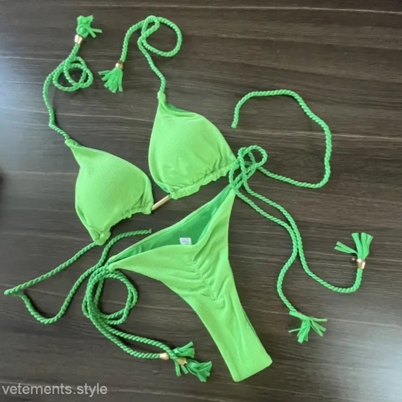 Bright green rope swimsuit bikini featuring braided ties and tassels for a trendy look