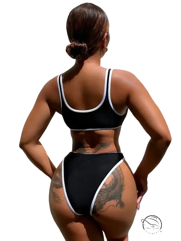 Black and white two-piece bikini swimsuit with dragon tattoo on hip