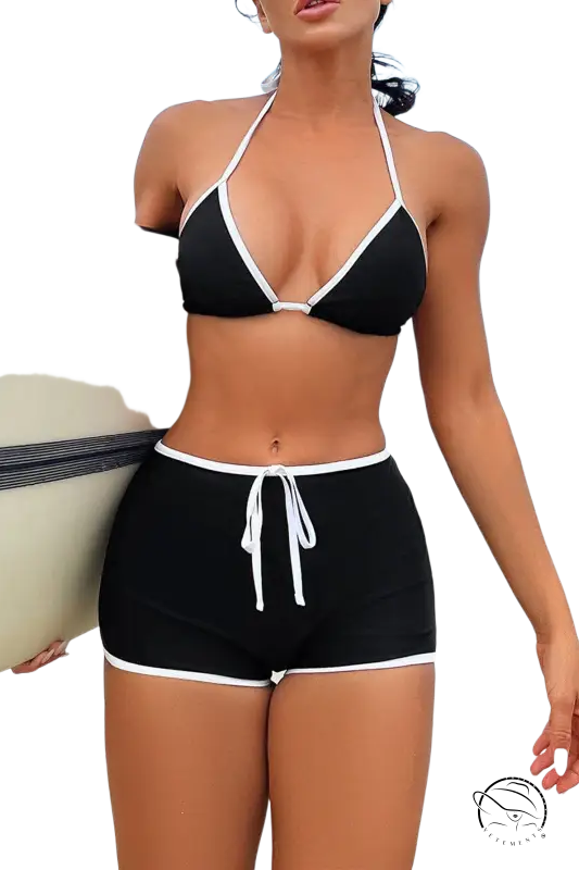 Black and white boho strap split swimsuit with halter top and high-waisted shorts