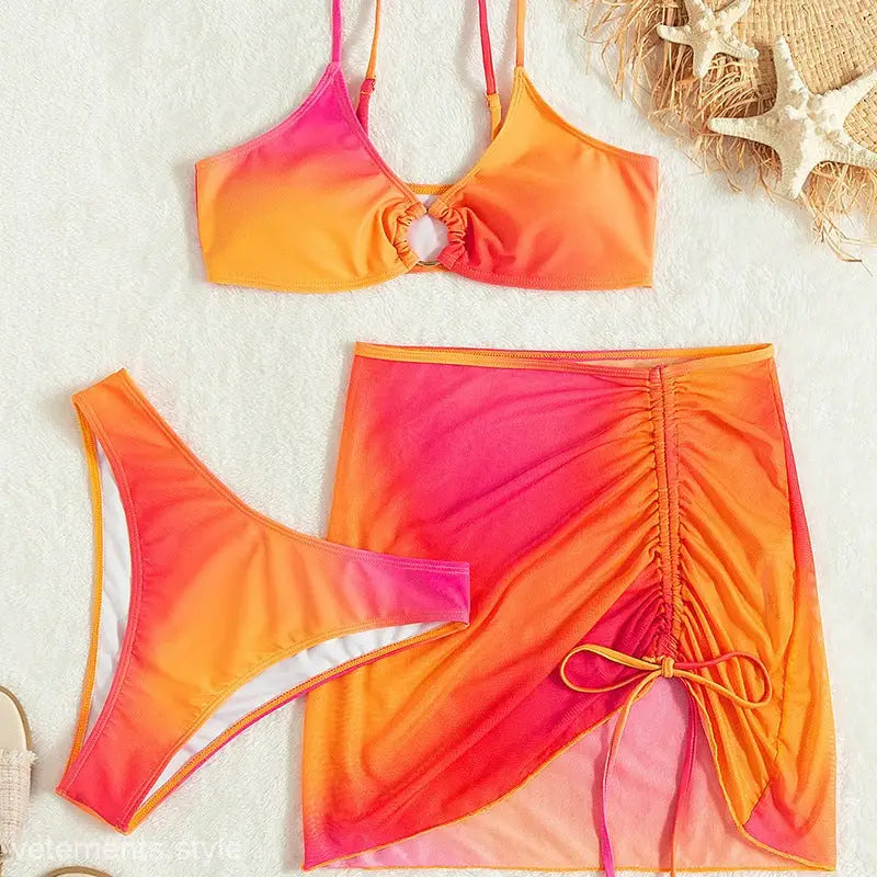 Ombre pink and orange three-piece swimsuit with ruched skirt and adjustable tie straps